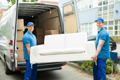 House removalists helping a local Andstorage household move furniture