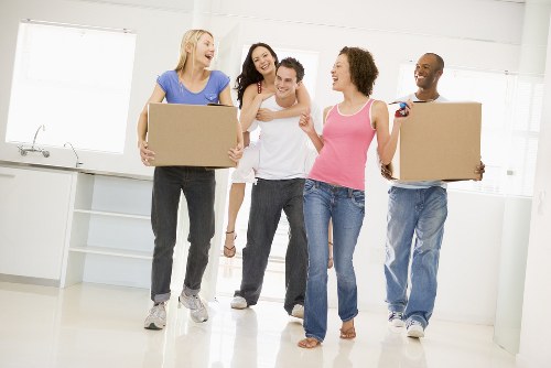 House movers in Andstorage loading boxes and furniture into a moving vehicle