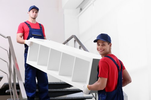 Commercial relocation items being loaded into a removal van