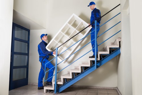 Local movers handling boxes and furniture near Andstorage
