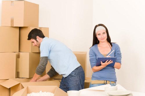 Local team removing bulky furniture from an apartment in Andstorage