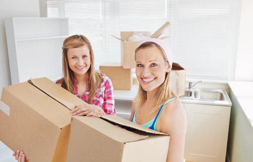 Packed office boxes and furniture ready for relocation in Andstorage